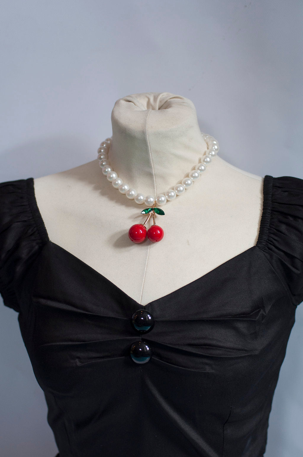 Körsbär på pärlshalsband